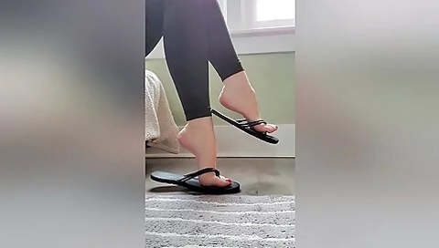 Foxy Girlfriend In Sexy Black Leggings Dangles Her Flip Flops