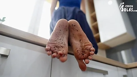 Blonde Housewife Sitting On Kitchen Counter Showing Off Her Dirty Feet And Toes
