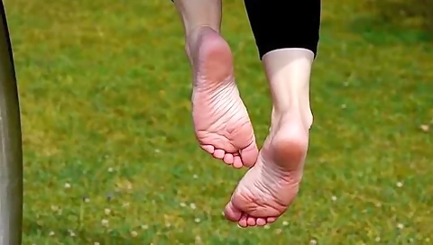 Rubbing Her Feet Together Sensually