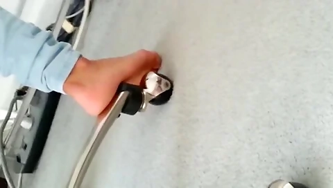 Feet Pressing Against White Carpet