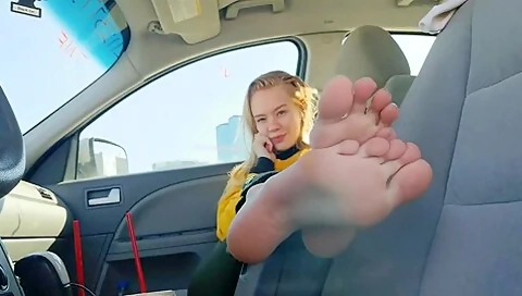 Charming teen 18+ Goes Barefoot In The Car And Touches Her Cute Feet