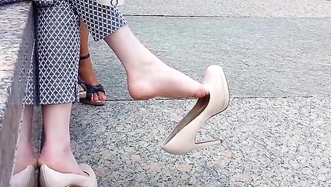 Creme Leather Pumps Dangling In The Air