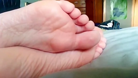 Feet Closeup While Amateur Lounges On Bed