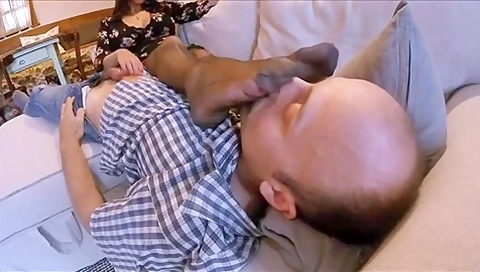 Old Man Getting A Nice Handjob While Sniffing Busty Womans Feet On The Sofa