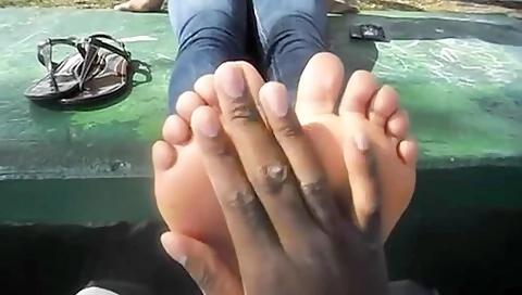 Sweet Ebony Girl Gets Her Smooth Soles Worshipped By A Handsome Black Guy Outdoors
