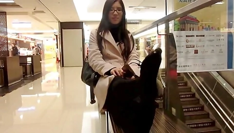 Attractive Asian Sophisticated Woman Exposes Her Lovely Feet At The Shopping Mall