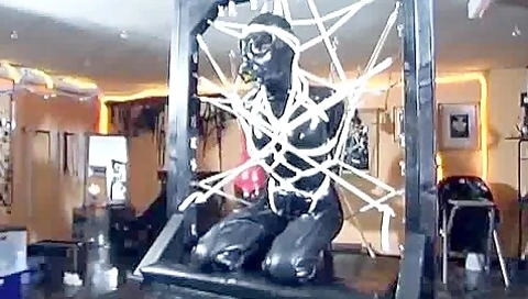 Latex Slave In Bondage
