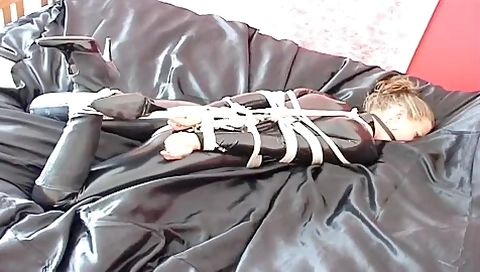 Catsuit Hogtied And Ball Gagged