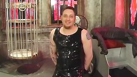 Dominatrix And Slave Boy In Dungeon