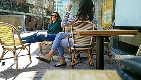 Two Delicious Brunettes Get Their Candid Feet Filmed At The Caffe
