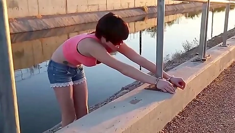 Girl Handcuffed To Roadside Railing By A Girl