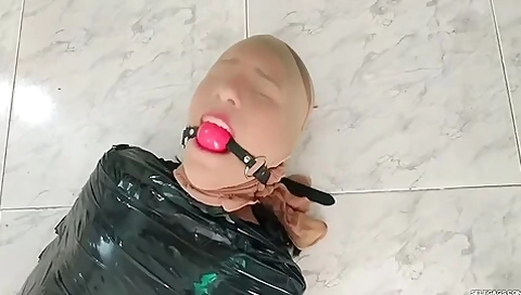 Tape Mummified Girl Pantyhose Hooded And Ball Gagged