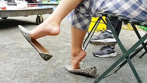 Horny Catches A Delicious Brunette Playing With Her Shoe In Public