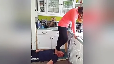 Amateur Housewife Slapping Her Mans Face With Her Feet In The Kitchen